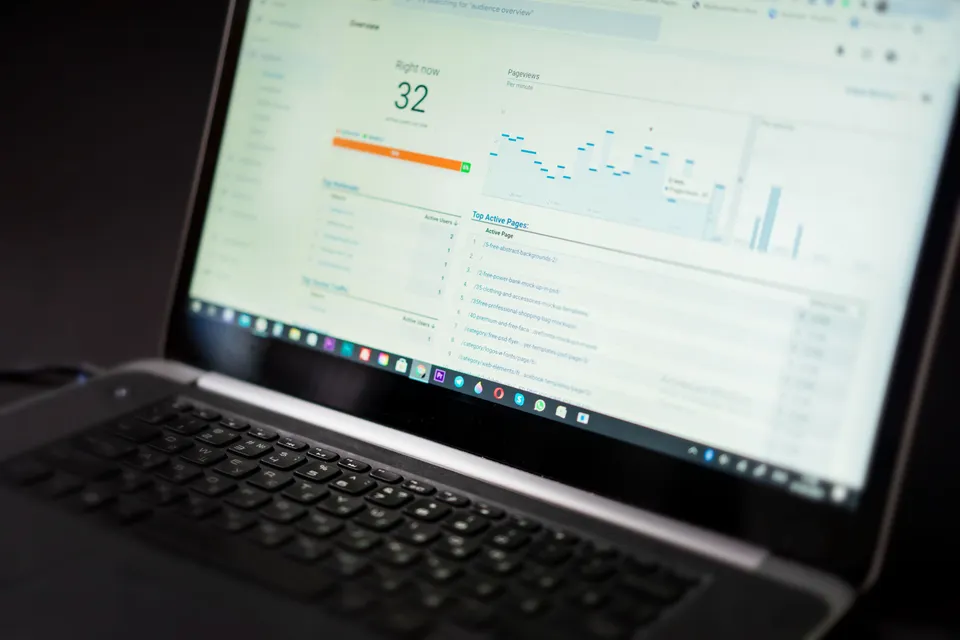 Laptop displaying an analytics and monitoring dashboard